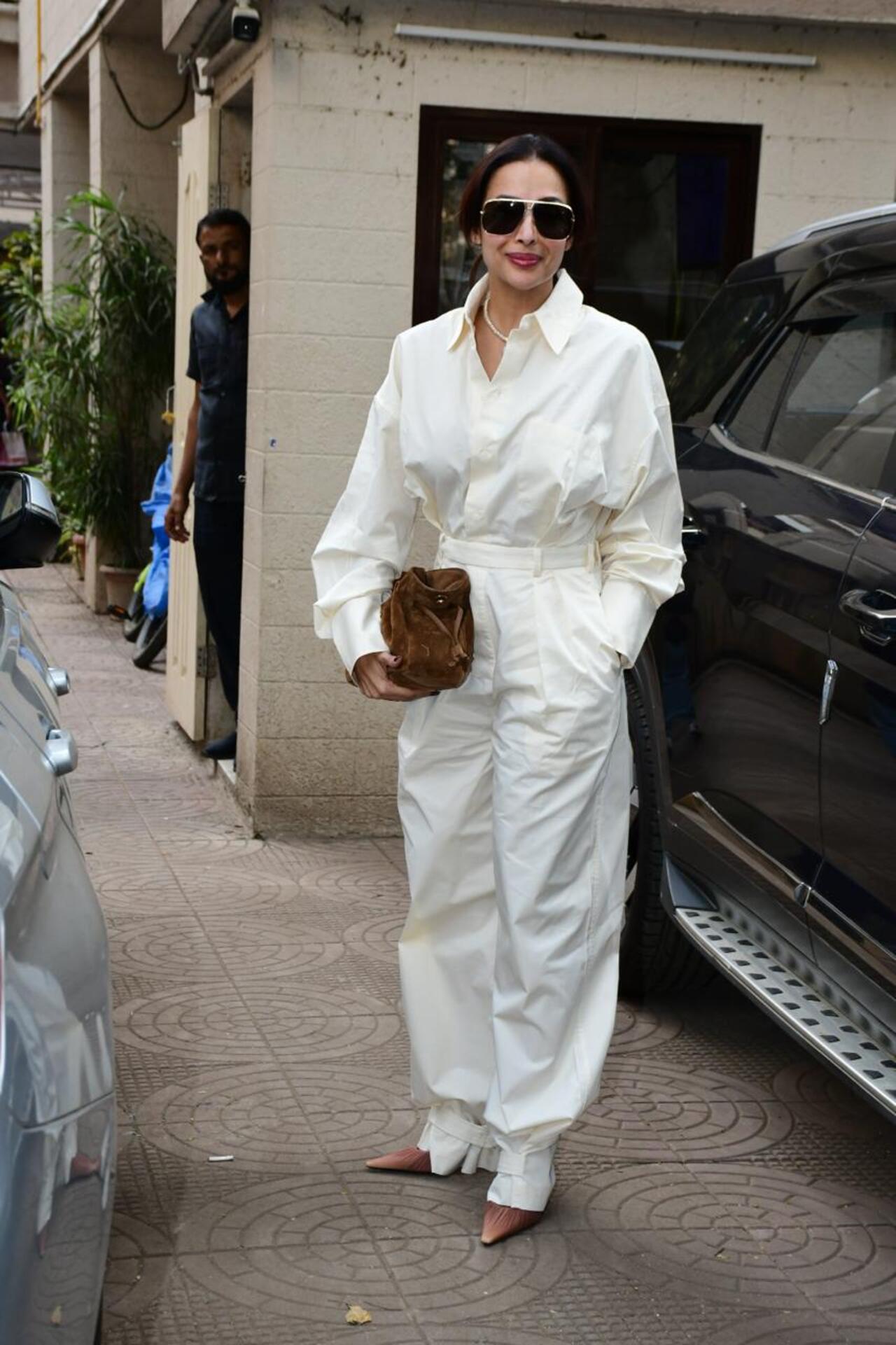 Malaika Arora looked classy in white as she arrived for a Christmas party in the city